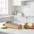 Wooden Cheese Grater Box With Drawer - in a white kitchen with cheese and olive oil