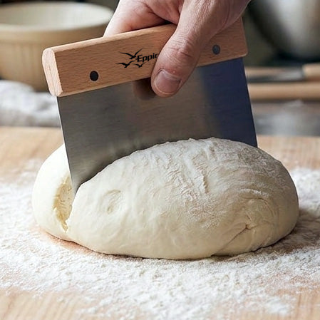 Eppicotispai dough scraper being used to cut a dough ball in half