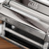 Close-up of a pasta maker with 'Atlas Motor' branding on the rollers.