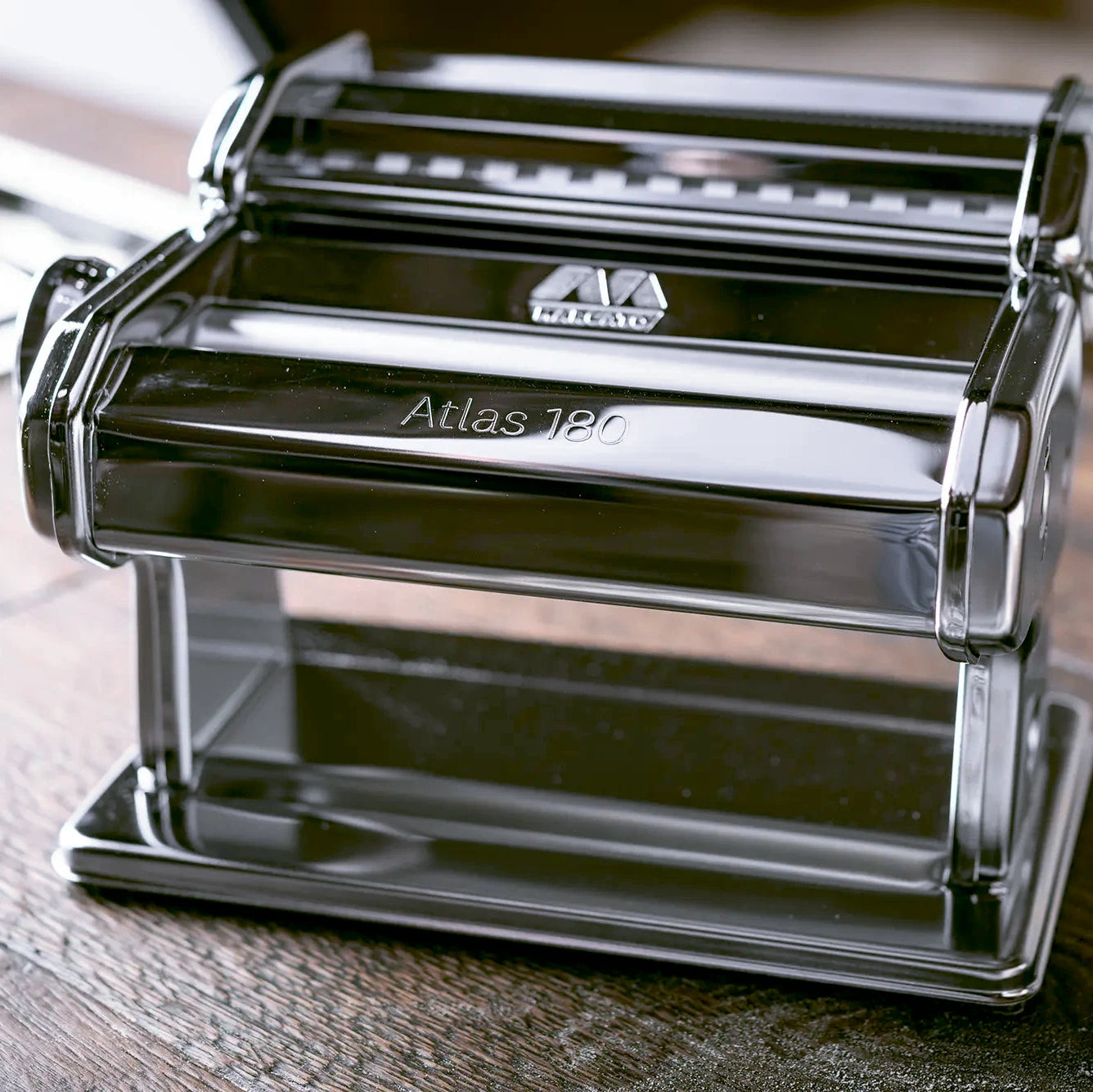 Marcato Atlas 180 pasta maker on a wooden surface