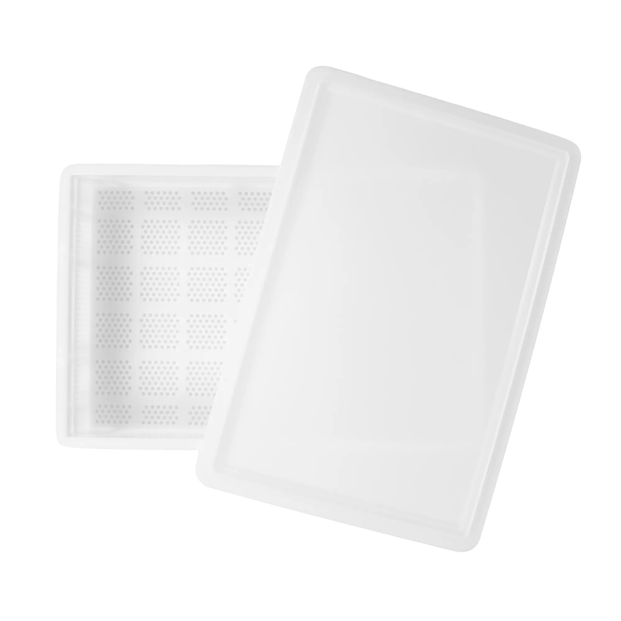 Top-down view of the empty 60 x 40cm perforated pasta and dough tray with a lid placed off centre on top