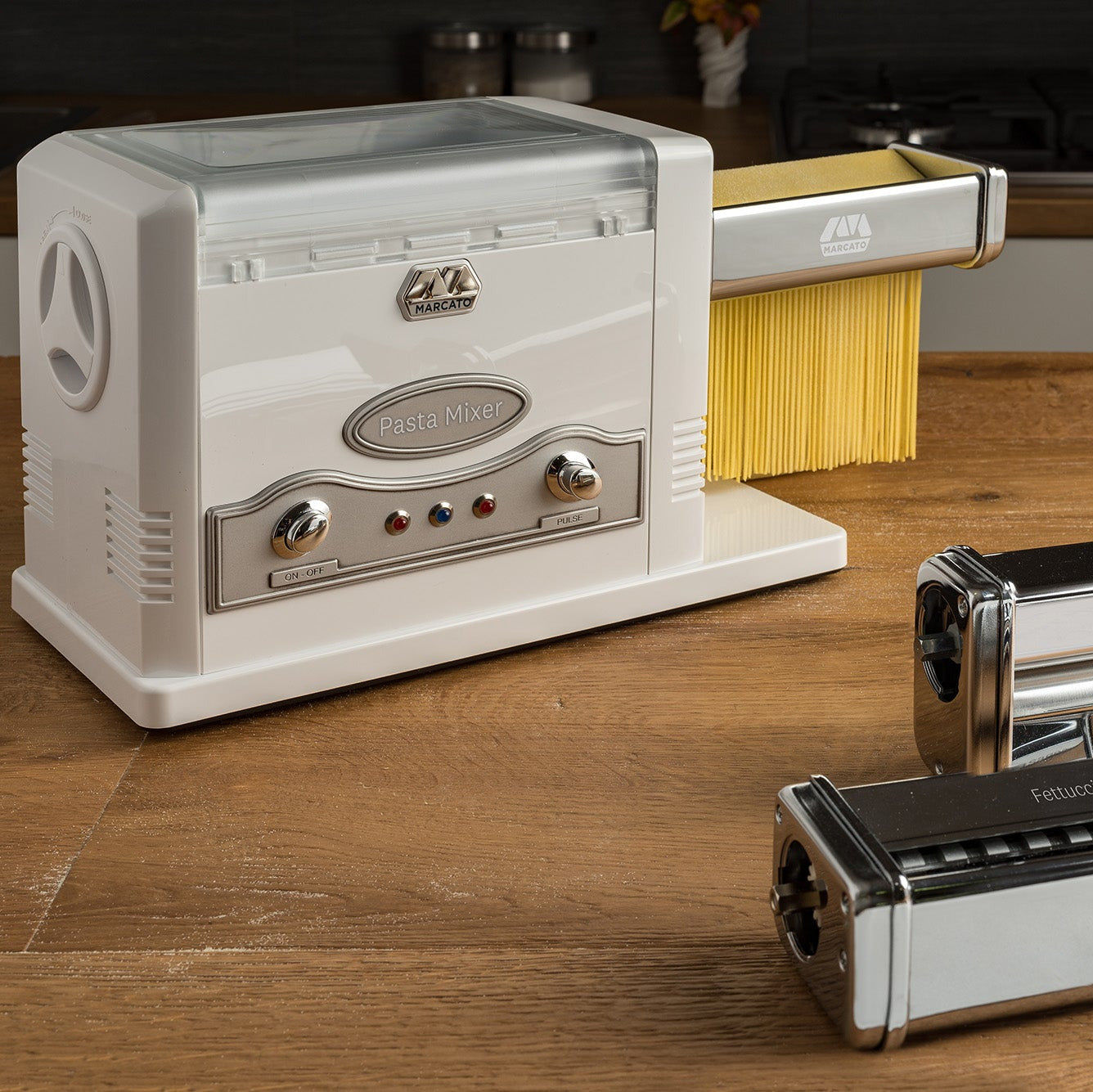 Marcato Pasta Fresca on a wooden surface with attachments