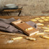 Marcato Rigagnocchi gnocchi and garganelli paddle with rolling pin next to handmade garganelli on a wooden bench