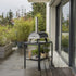 ZiiPa Piana wood-fired pizza oven in Charcoal on an outdoor terrace