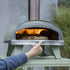 ZiiPa Piana wood-fired pizza oven in Eucalyptus outdoors in a garden setting