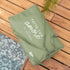 Fontana travel bag for ZiiPa Piana Pizza Oven in Eucalyptus on wooden decking next to a pool