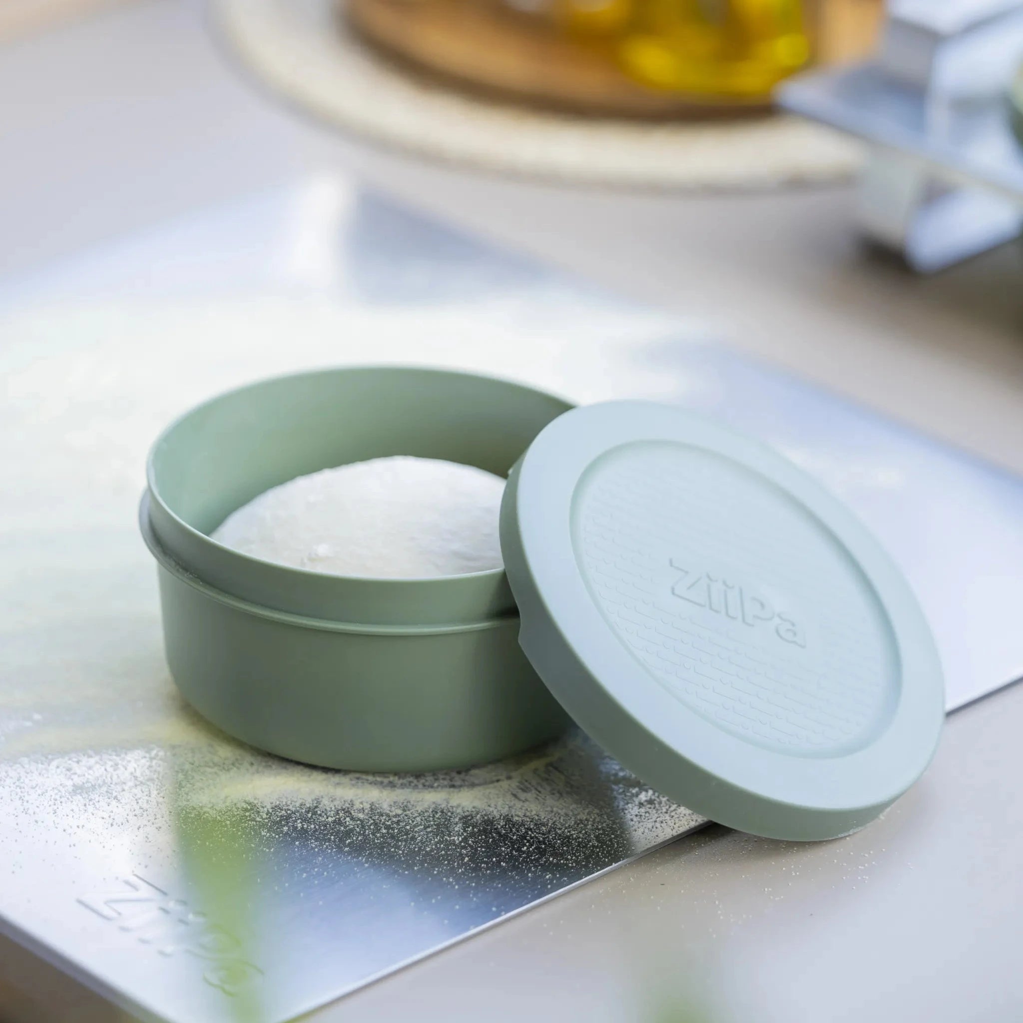 Eucalyptus Spetina dough boxes on a stainless steel board
