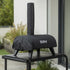 ZiiPa Piana pizza oven in a Sacco protective cover on a Vallone pizza oven trolley on an outdoor patio