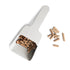 ZiiPa Melfa pellet scoop in Chalk on a white background with wood pellets