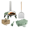 ZiiPa Piana Starter Kit in eucalyptus: pizza oven, pizza peel, storage bag, box of beech pellets, and pellet scoop.