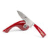 Berkel Manual Knife Sharpener being used with a red Elegance chef's knife on a white background