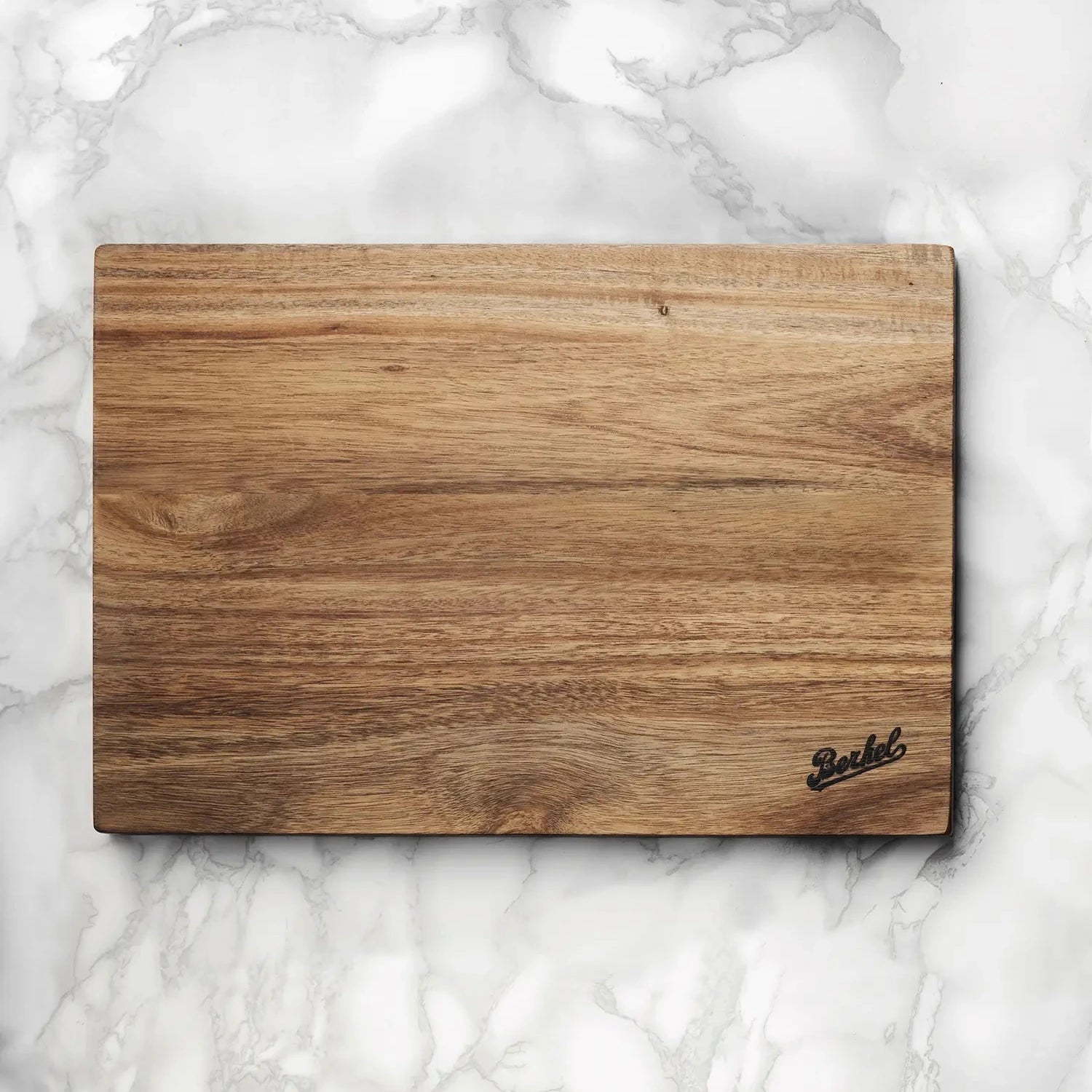 Wooden cutting board with Berkel branding on a marble surface